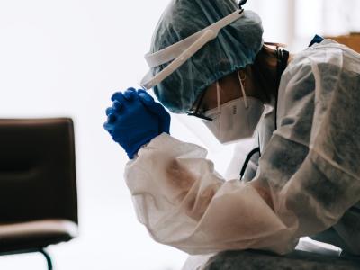 Fatigued healthcare worker wearing protective equipment