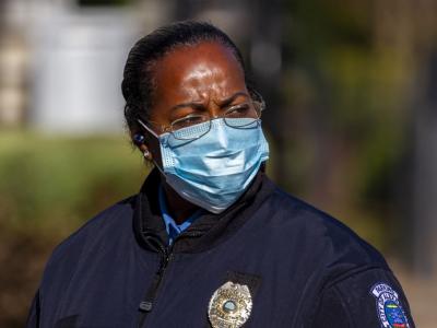 Female police officer wearing a mask