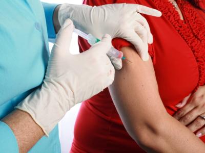 Pregnant women receiving flu shot