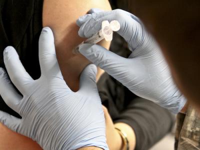 Flu vaccine being injected