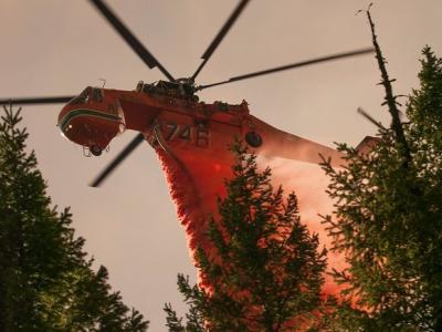 Helicopter fighting forest fire