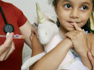 Girl getting vaccinated