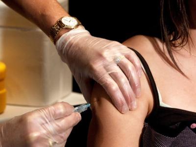 Girl receiving shot in arm