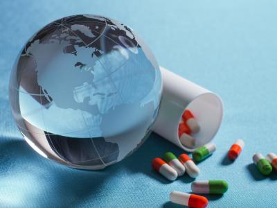 Glass globe and spilled capsules