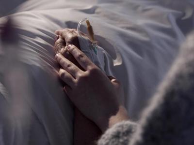 Hand holding in hospital
