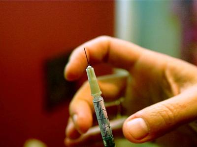 Hand with syringe