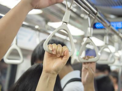 Hands on subway straps
