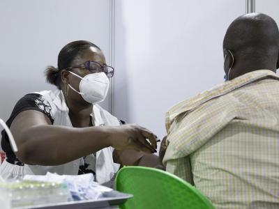 Healthcare worker giving COVID vaccine
