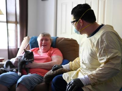 Healthcare worker wearing PPE in nursing home