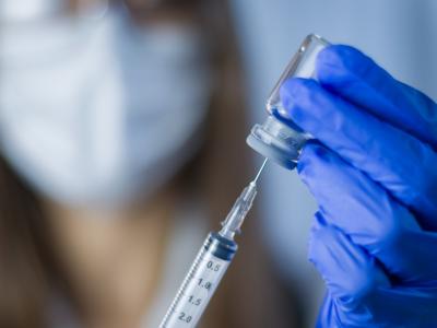 Drawing vaccine into a syringe
