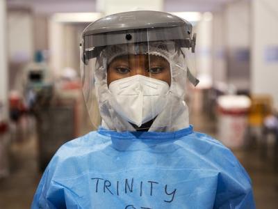 Healthcare worker wearing respirator, face shield