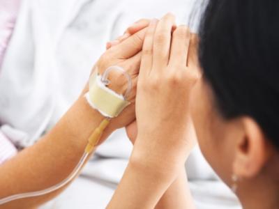 Holding patient's hands