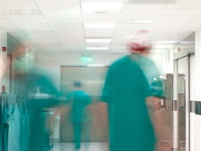 Hospital corridor with blurry doctors