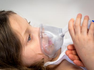 Hospitalized girl getting respiratory support