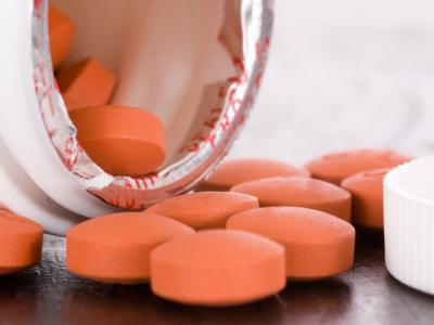 Bottle spilling out pills
