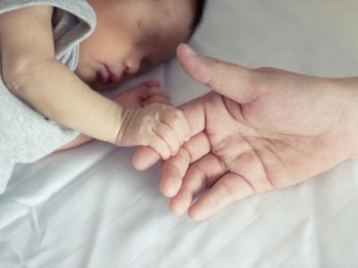 Infant grasping finger