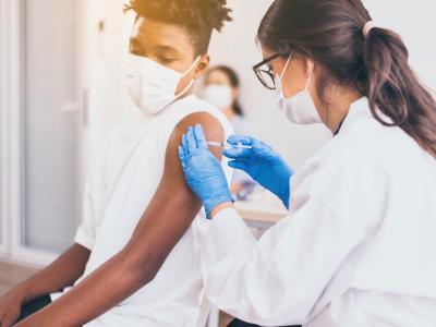 Boy getting COVID-19 vaccine