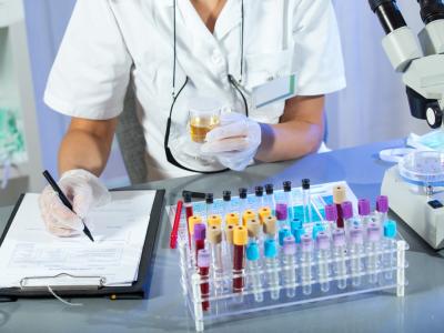 Lab technician conducting urinalysis