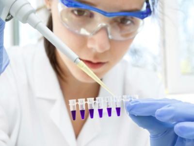 Lab worker loading PCR samples