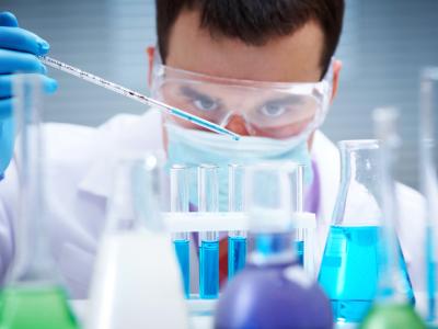 Lab worker with test tubes