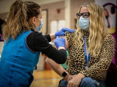 Woman getting COVID-19 vaccine