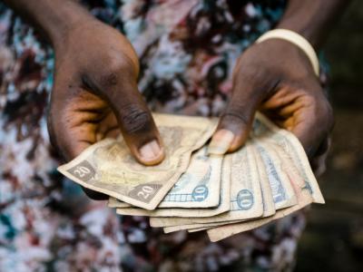 Paper money in a person's hands