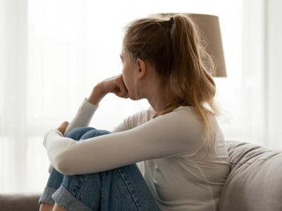 Lonely girl on couch