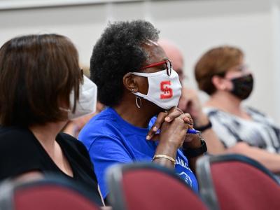 Women in meeting wearing masks