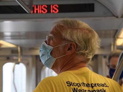 Man wearing mask on bus