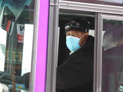 Bus driver wearing surgical mask