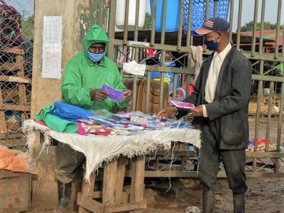 Masked seller and buyer in Kenya