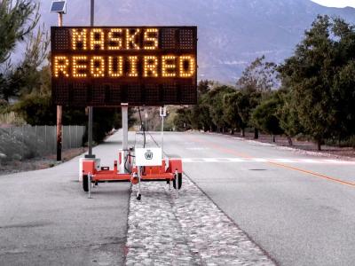 "Masks required" roadside sign