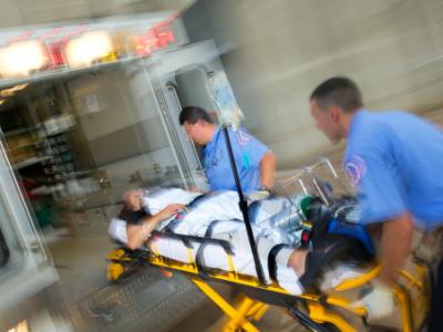 Patient being loaded into ambulance