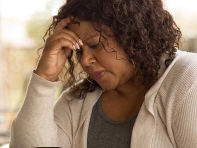 Middle-aged woman looking sad
