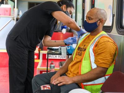 Man getting vaccine in mobile unit