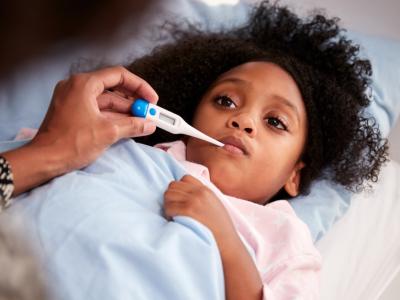 Mom taking child's temperature