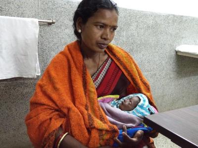 Mother holding baby who has sepsis