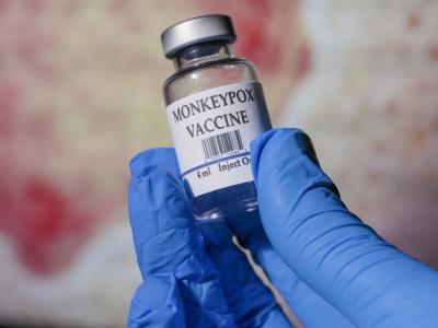 Monkeypox vaccine vial in gloved hand