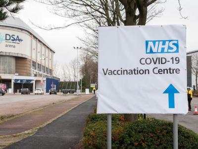 COVID vaccine center sign in England