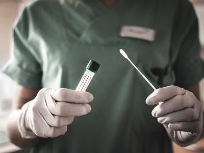 Nurse holding swab