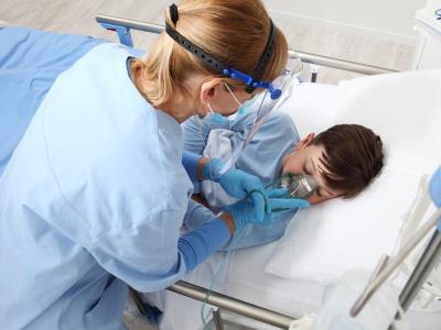 Nurse caring for boy in hospital