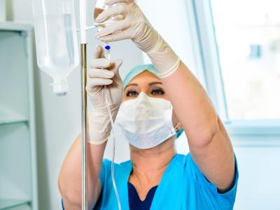 Nurse with IV stand