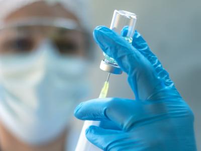 Nurse with vaccine vial and syringe