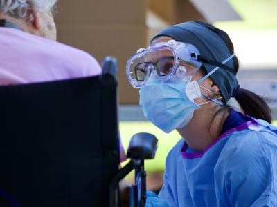 Nurse with elderly woman in wheelchair