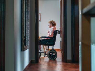 Nursing home resident alone in wheelchair