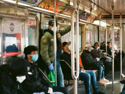 New York subway commuters wearing masks