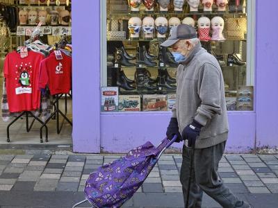 Old man wearing mask in street