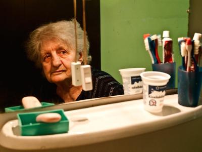 Old woman in mirror
