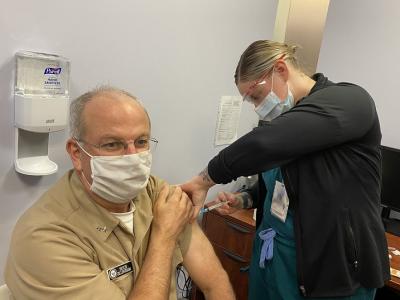 Older man getting the flu vaccine