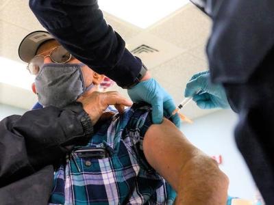Elderly man getting COVID vaccine